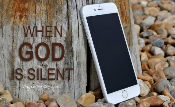 When god is Silent, cellphone leaning against tree
